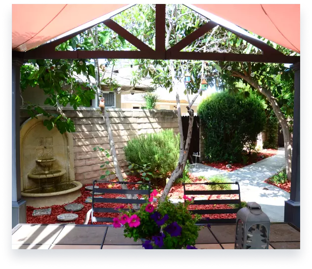 Backyard with fountain and flowers for luxury sober living Orange County