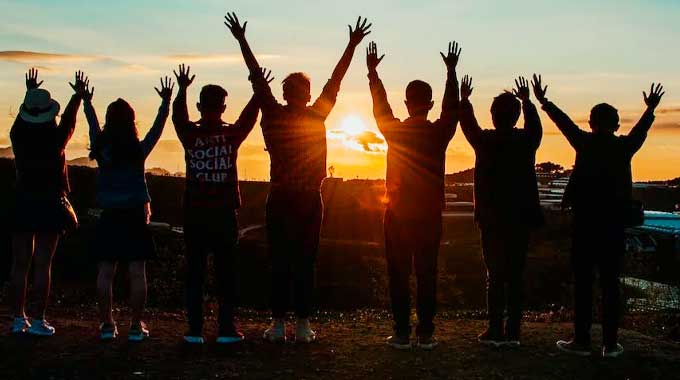 Group session enjoying a sunset and positive vibes with a recovering group in Cornerstone's Orange County sober living program