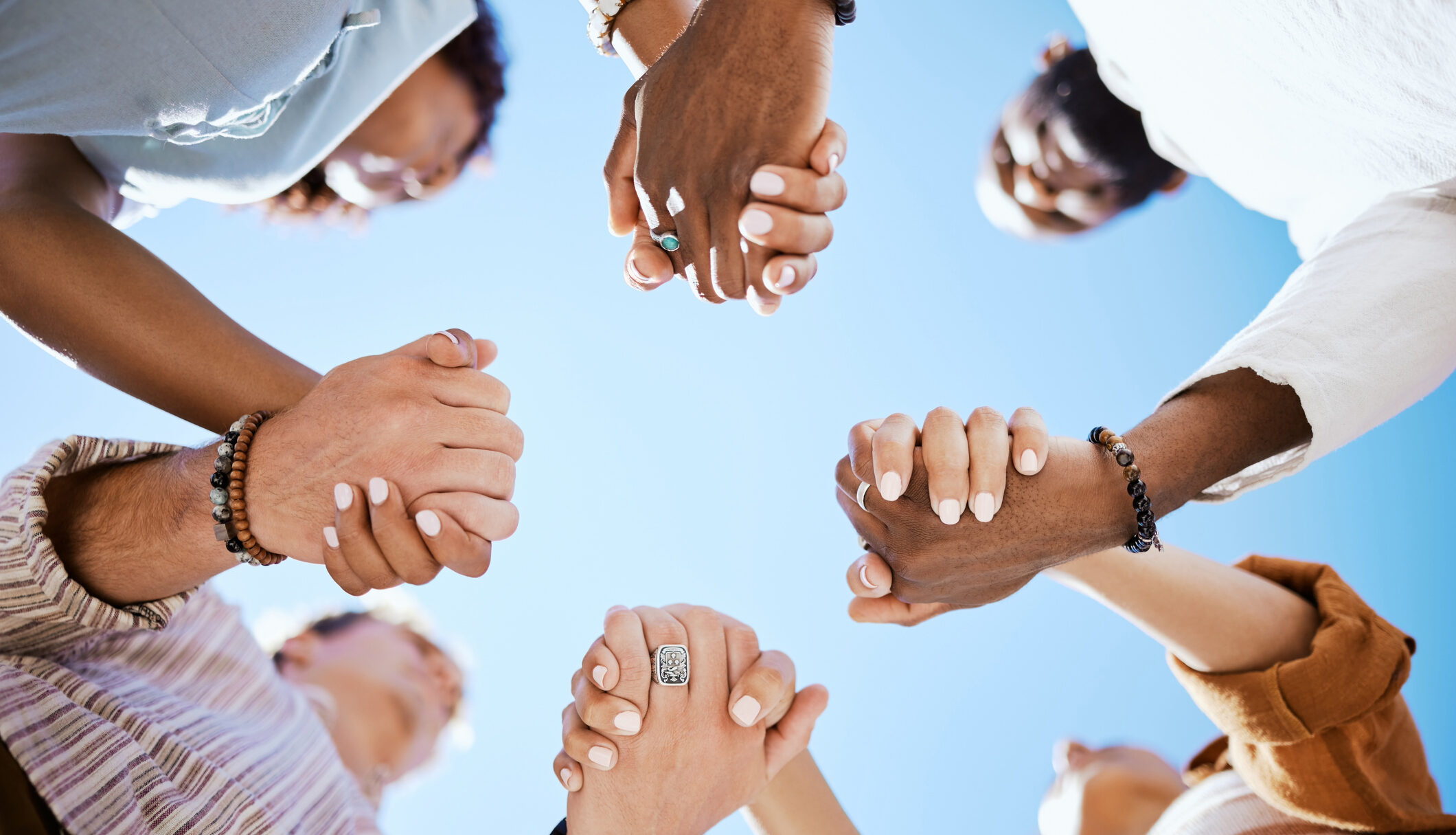 Clients at Cornerstone's inpatient rehab in Orange County, holding hands and supporting one another on their recovery journey