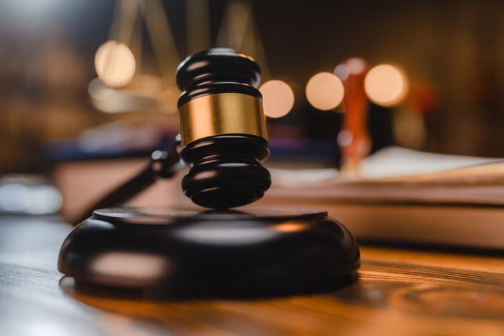 Judge gravel hammer in courtroom