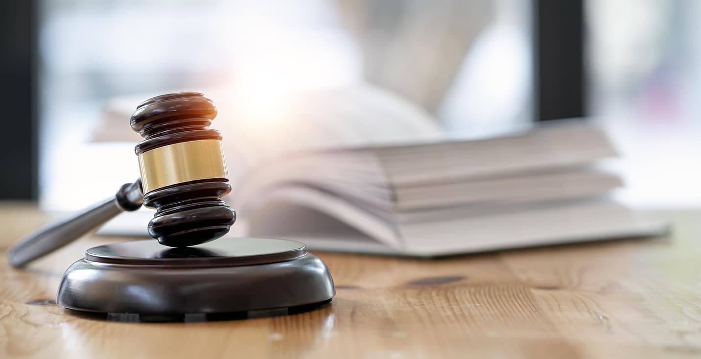 Wooden judge gravel on the table at a drug court